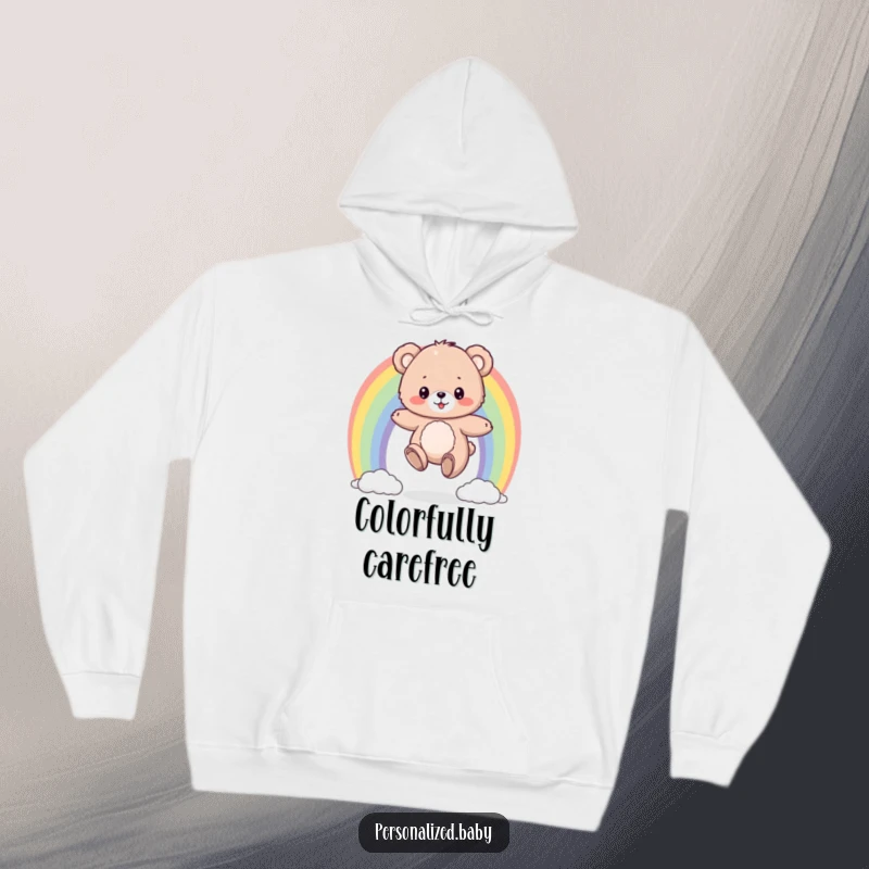 Funny hoodie with a fluffy bear cub bouncing on a colorful rainbow, offering warm, comfortable, and cheerful vibes.