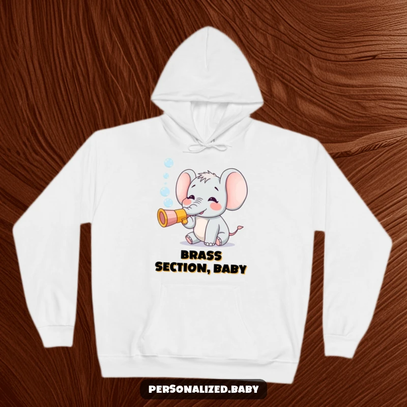 Funny hoodie depicting a small, ecstatic elephant blowing iridescent bubbles from a toy trumpet, embodying playful happiness.