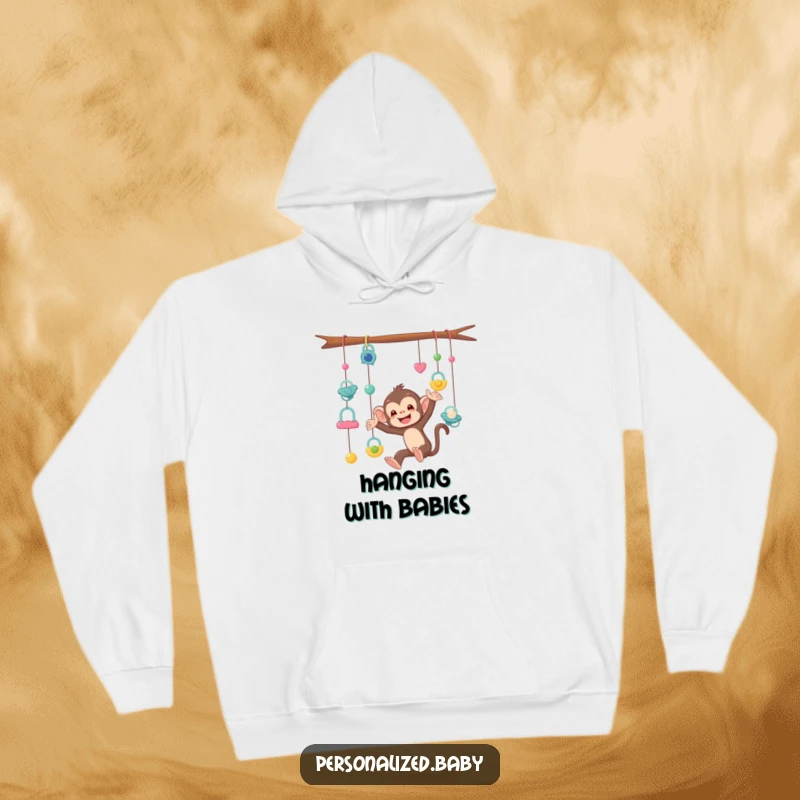 Funny Hoodie showcasing a mischievous monkey tangled in a mobile of pacifiers, ideal for parents who appreciate humorous relatable designs.