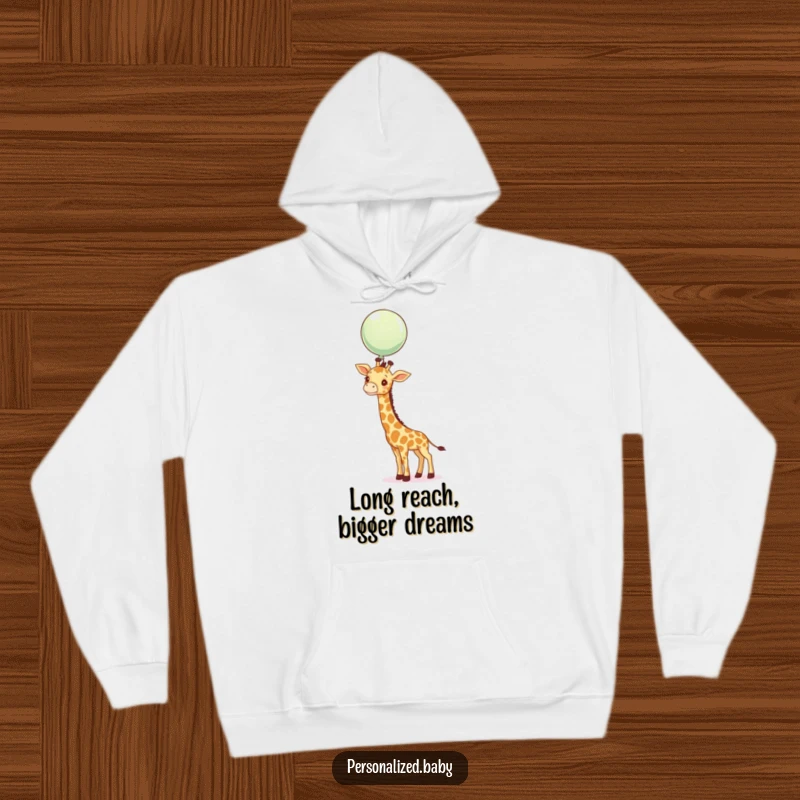 Funny curious giraffe stretching its neck towards a floating balloon, a cozy and humorous hoodie.