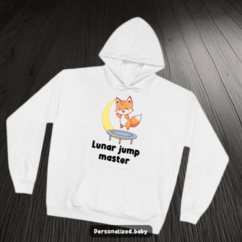 Funny hoodie with a fox cub gleefully bouncing on a crescent moon, a cozy and humorous garment for dreamers.