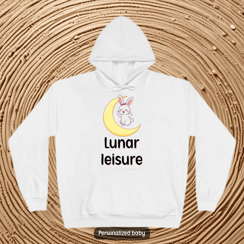 Funny hoodie featuring a happy bunny hopping gleefully on a large crescent moon, evoking nocturnal delight.