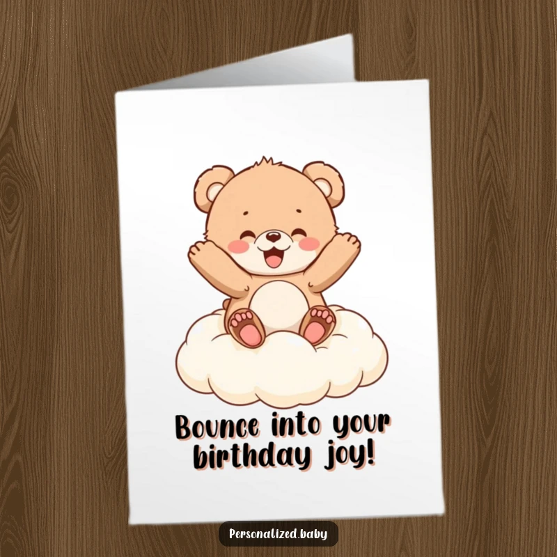Funny Free Printable Birthday Card: Fluffy bear cub bouncing gleefully on a cloud-shaped cushion, celebrating joyfully.