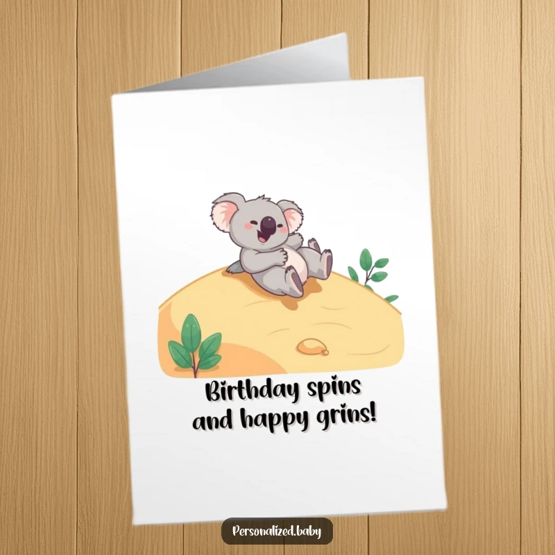 Funny Free Printable Birthday Card: Giggling koala bear tumbling playfully down a smooth hillside, full of joy.