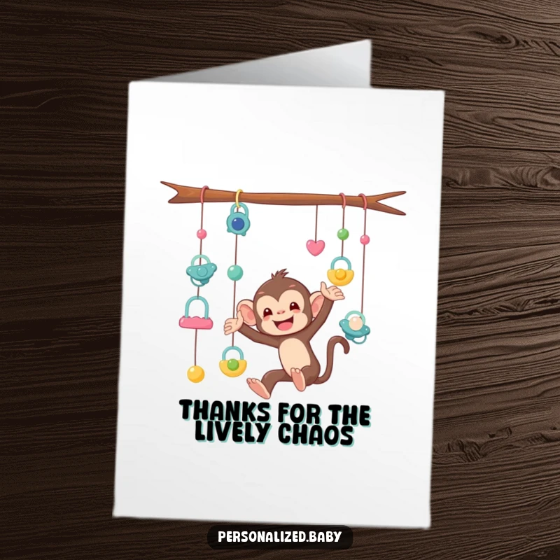 Funny Free Printable Thank You Card: A mischievous monkey character is stuck in dangling pacifiers, expressing thanks humorously.
