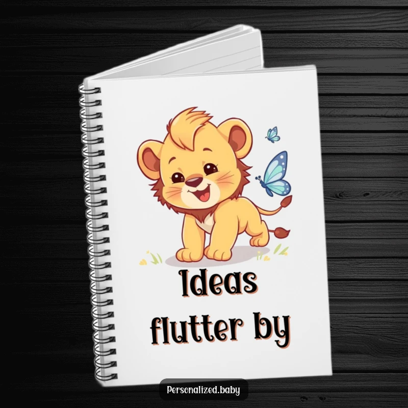 Funny notebook cover with a clumsy baby lion cub chasing a sparkling butterfly, for writing down thoughts.
