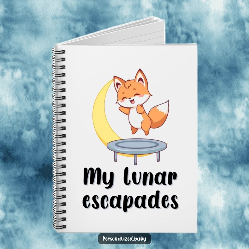 Funny notebook with a fox cub bouncing on a crescent moon, a humorous stationery item for capturing dreams.