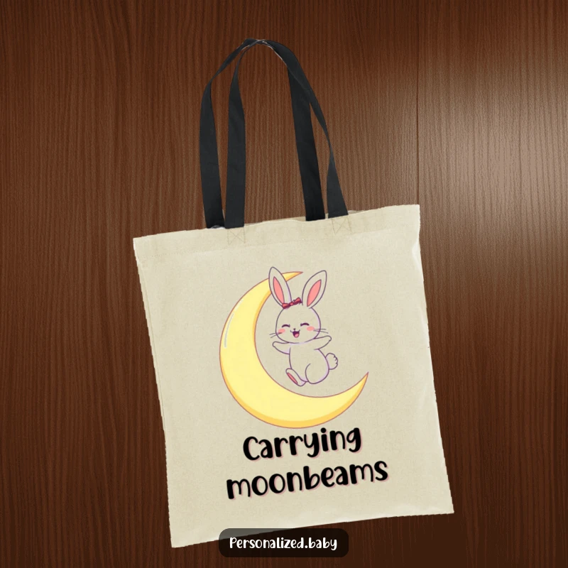 Funny tote bag with a giggling bunny playing on a large crescent moon, bringing celestial charm.