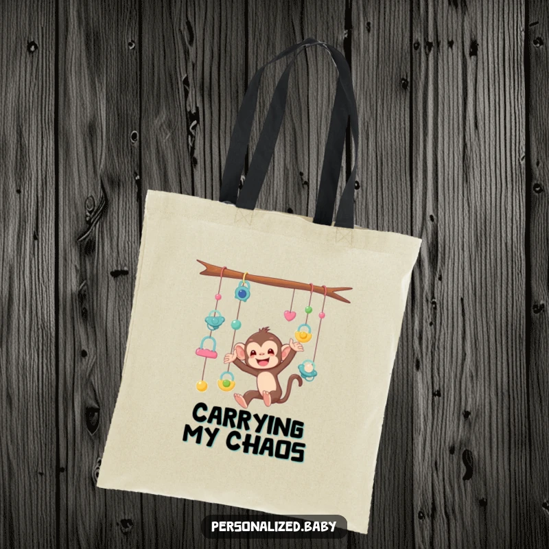 Funny Tote Bag featuring a mischievous monkey tangled in a mobile of pacifiers, a humorous and practical accessory for parents.